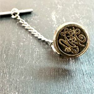 Tie Tack with unknown characters